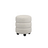 angled cut out image of ivory boucle pouffe