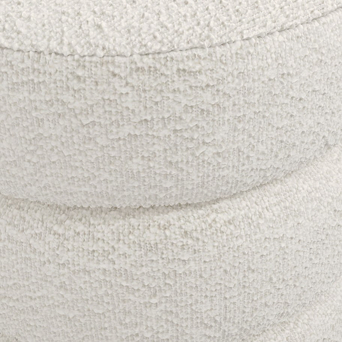 close up on ivory boucle fabric of pouffe