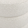 close up on ivory boucle fabric of pouffe