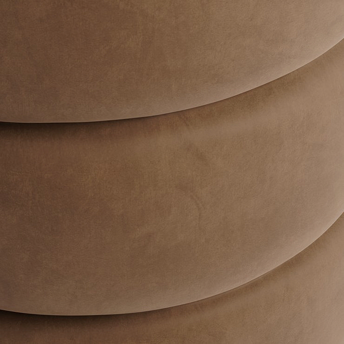 close up on mole coloured velvet fabric of pouffe