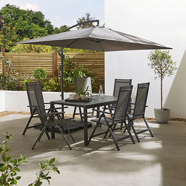 image of rectangular grey parasol on sunny patio without table and chairs