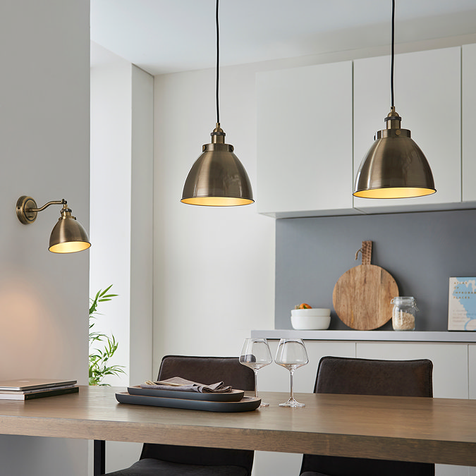image of antique brass pendant lights hanging over a kitchen table