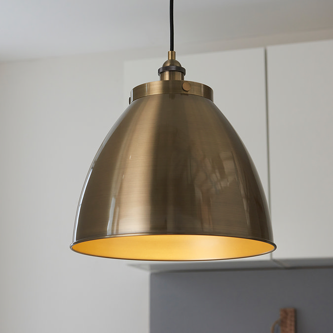 close up image of large antique brass pendant light
