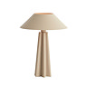 image of matt beige sculptural lamp with light on emitting warm glow