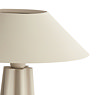 close up image cut out on white background of matt beige lamp with sculptural body