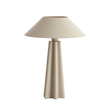 image of matt beige sculptural lamp with light on emitting warm glow
