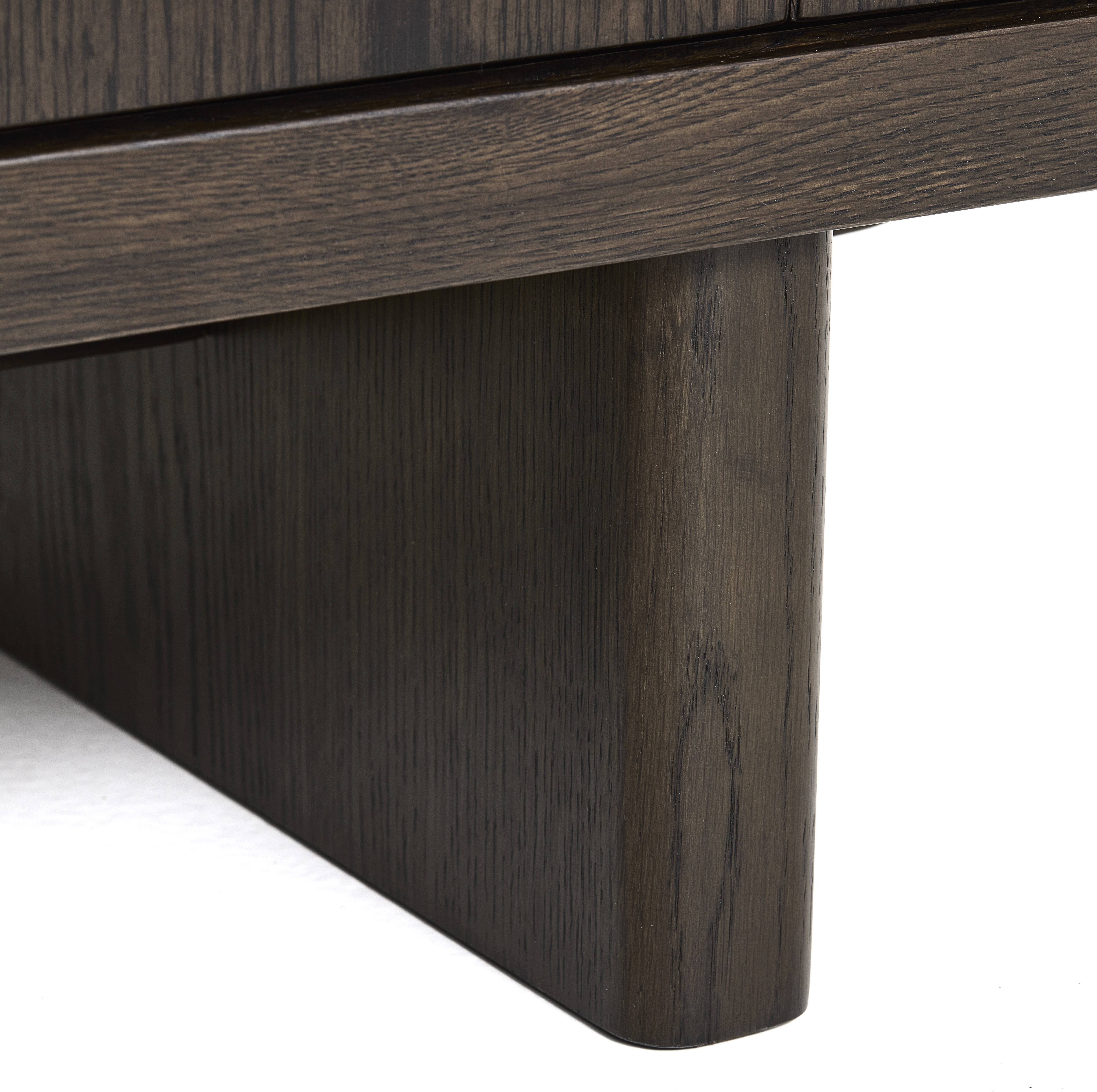 close up image of wooden feet of dark oak sideboard