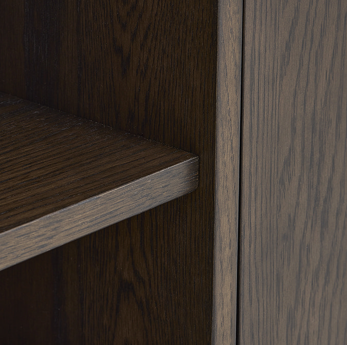 close up on dark oak wood grain of media tv unit