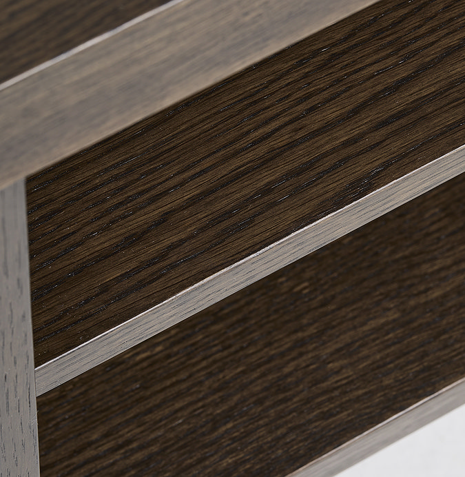 close up image of middle shelving section of dark oak media unit