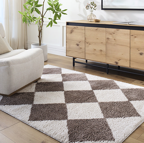 image of brown and cream diamond patterned rug on light wood flooring