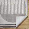 image of dark grey modern rug with corner folded up to show material underneath