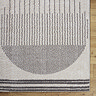 close up image of cream rug with modern grey central circle design