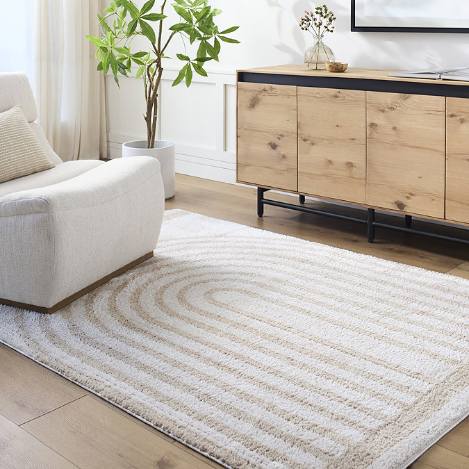 image of beige and cream line arch rug on light wood floor of living room