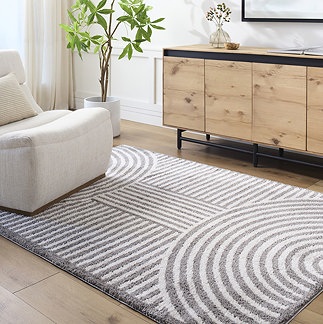 image of dark grey line arch geometric rug on light wood flooring