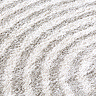 close up zoomed in image of cream and light grey line arch rug