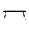 image cut out on white background of light oak dining table with black legs