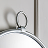 close up image of decorative loop on top of soft silver iron wall mirror