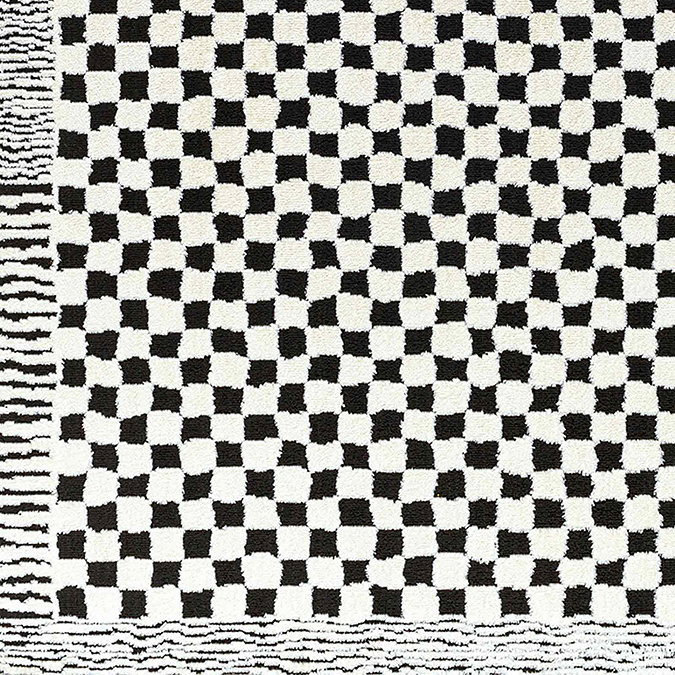 close up swatch image of black and white soft checkerboard rug with subtle border
