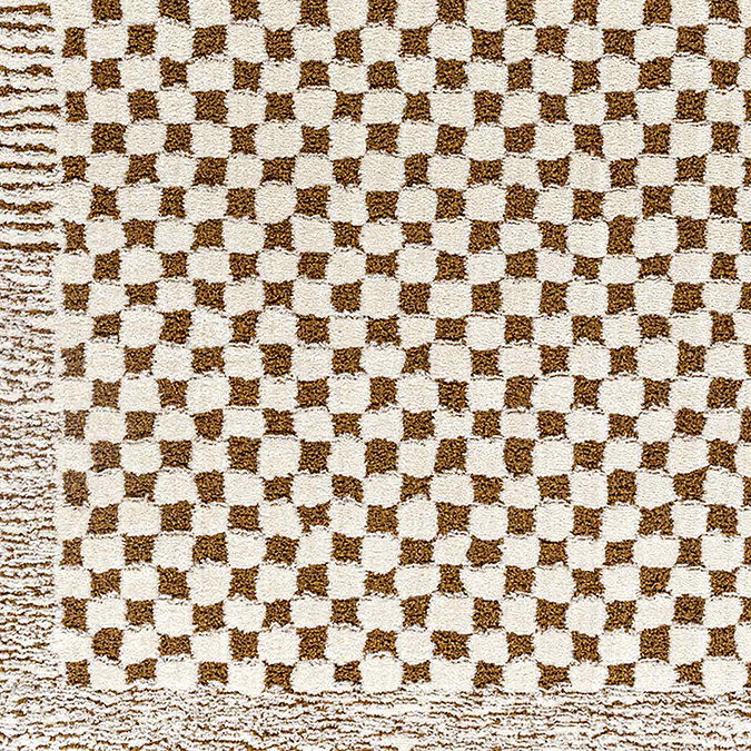 close up swatch image of ivory and brown checkered soft rug