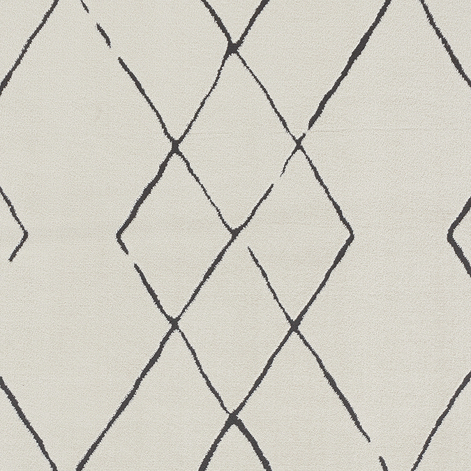 close up swatch image of soft ivory rug with black diamond pattern