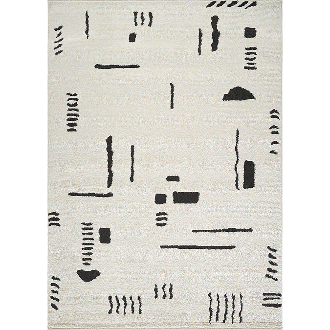 image cut out on white background of ivory rug with black abstract shapes