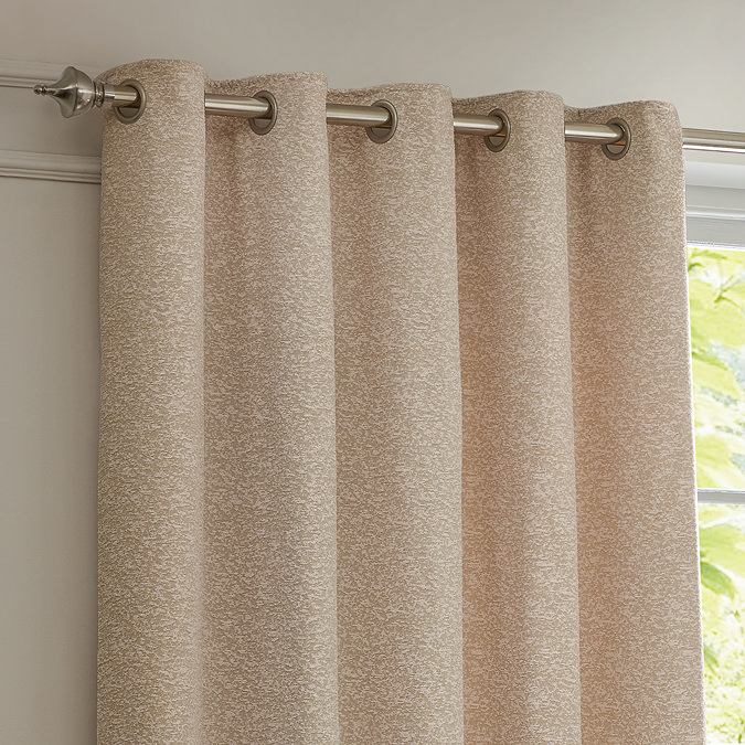 Galaxy Eyelet Curtains in Blush close up image of them hanging over a window
