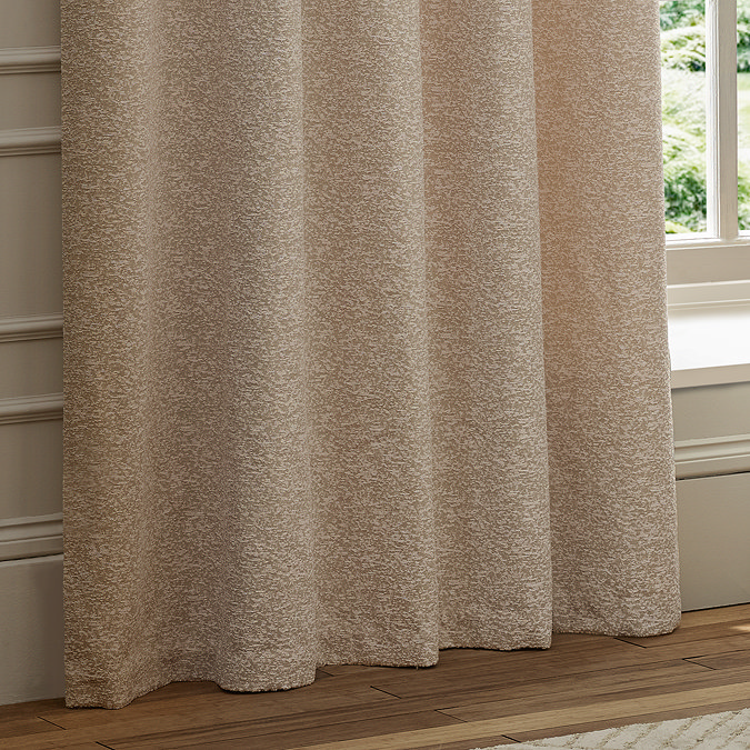 Galaxy Eyelet Curtains in Blush close up image of them hanging over a window