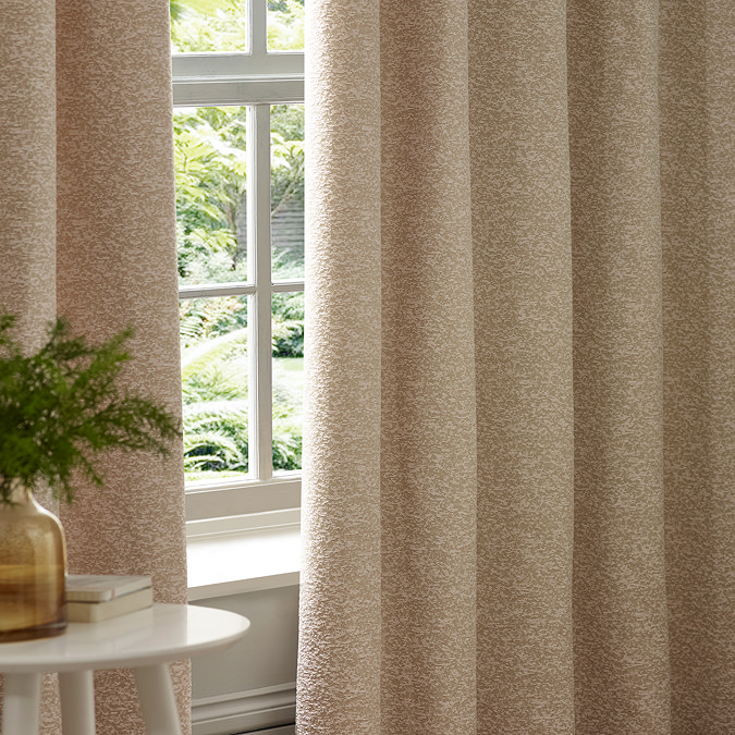 Galaxy Eyelet Curtains in Blush close up image of them hanging over a window