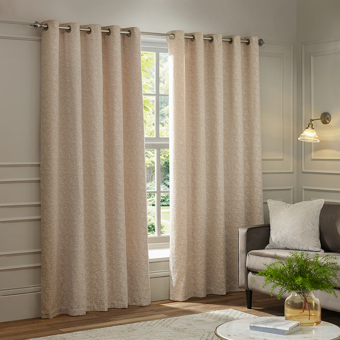 Galaxy Eyelet Curtains in Blush image of them hanging over a window
