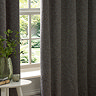 Galaxy charcoal eyelet curtains over a window close up image