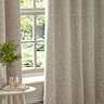 Galaxy Eyelet Curtains in Ivory over a window close up image