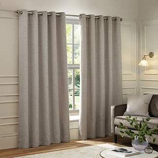 Galaxy Eyelet Curtains in Silver over a window image 