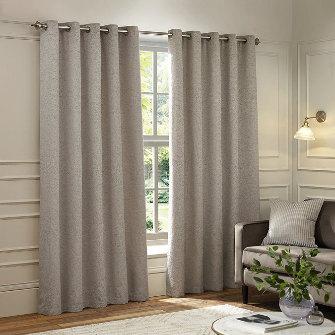 Galaxy Eyelet Curtains in Silver over a window image 