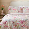 Gardenia ruffle bedding on bed image  3