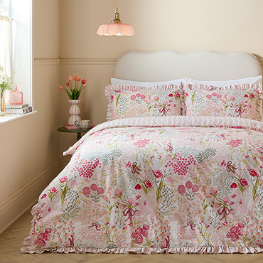 Gardenia ruffle bedding on bed image 1