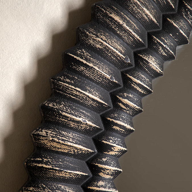 super close up image of textured floor length mirror in black