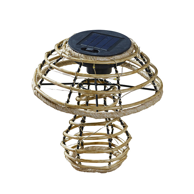 image cut out on white background of small rattan mushroom with solar panel cap