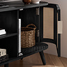 image of right hand side rattan door of a tv unit open to reveal storage space inside, with wicker basket inside