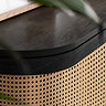 close up image on smooth curved edged top of black rattan sideboard