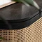 close up image on smooth curved edged top of black rattan sideboard