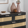 close up image of front of black 5 drawer chest with decorative accessories on top