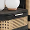 close up image of rattan style front single drawer of black bedside table
