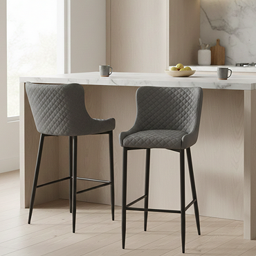 front on image cut out on white sideboard of faux leather grey bar stool with black steel legs and harlequin stitched seat