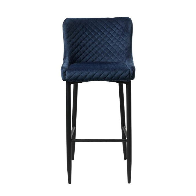 front on image cut out on white background of blue velvet bar stool with harlequin stitched seat and black metal legs