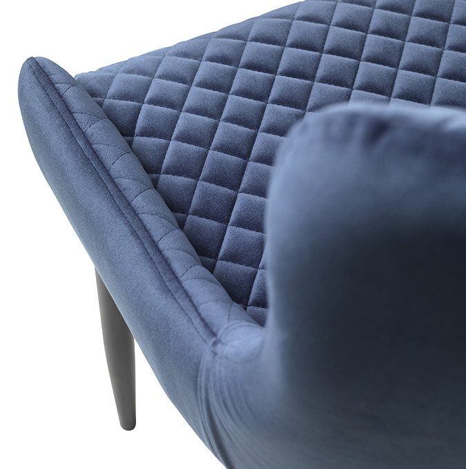 close up image of blue velvet bar stool seat with harlequin stitching