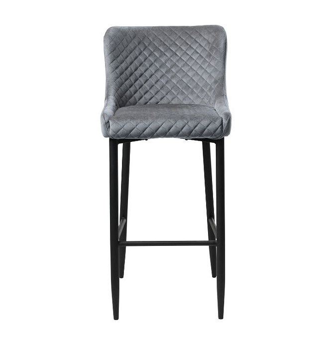 front on image cut out on white background of grey velvet dining stool with harlequin stitched seat and black steel legs
