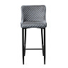 front on image cut out on white background of grey velvet dining stool with harlequin stitched seat and black steel legs