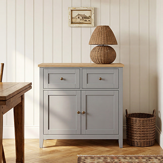 image of 2 door grey sideboard with wood top and rattan lamp placed on it
