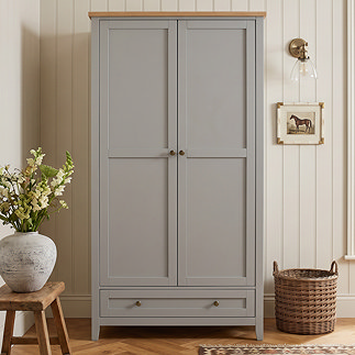 image of painted grey 2 door wardrobe with metal handles in bedroom