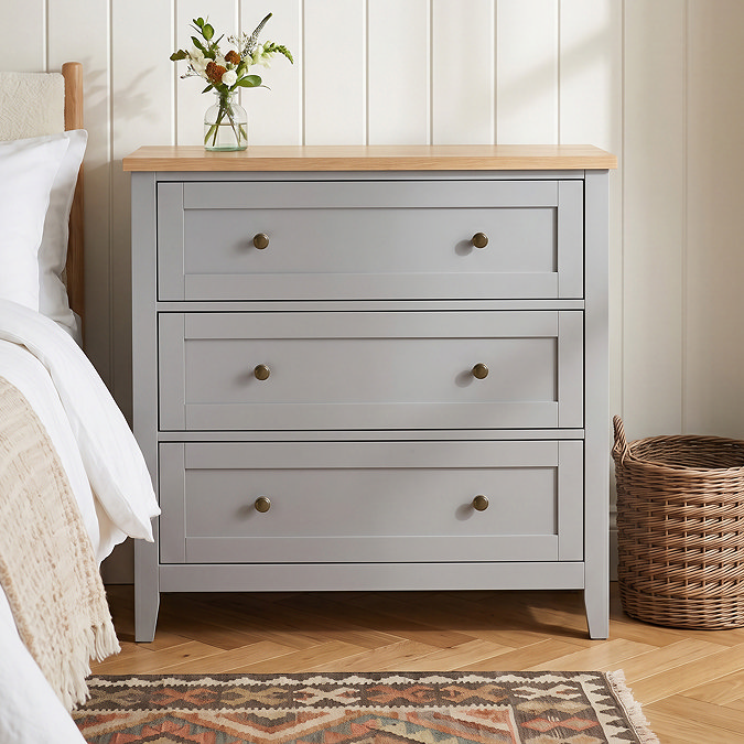close up image of three drawer chest in grey